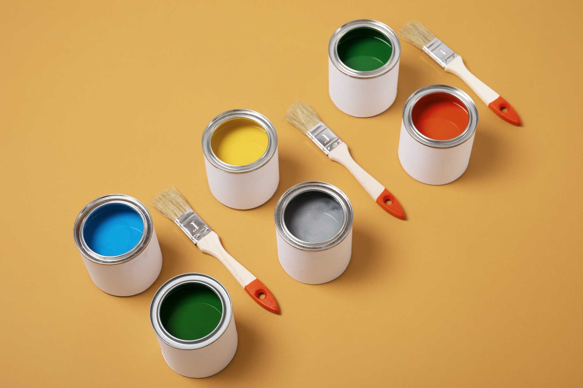 high-angle-colorful-paint-cans-arrangement_23-2149601043