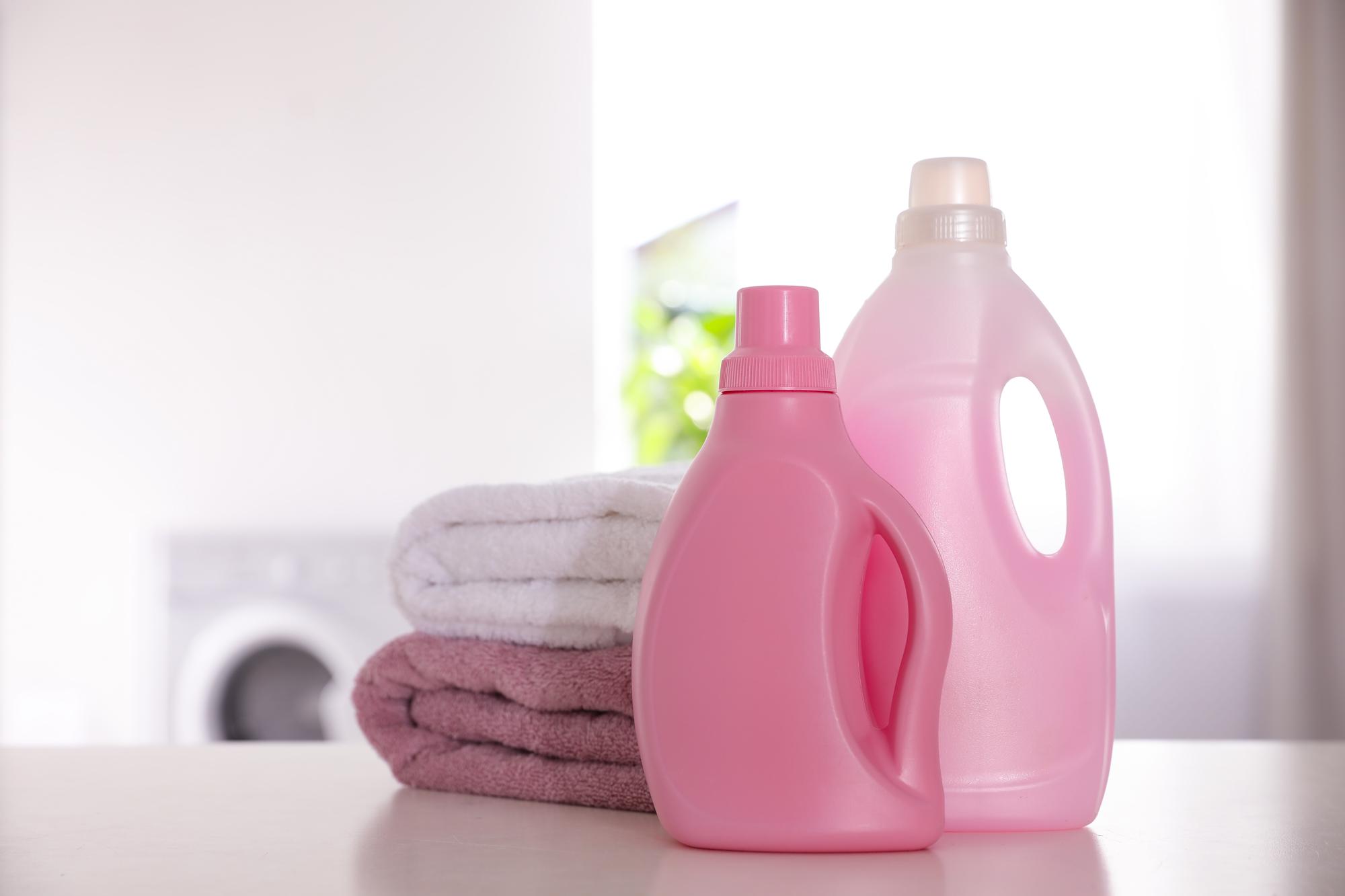 stack-clean-towels-detergents-white-table-indoors_495423-32037